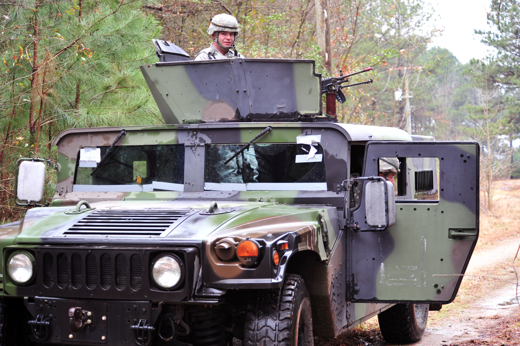 SHAW AIR FORCE BASE, S.C. -- Airmen of the 20th Security Forces Squadron neutralize the simulated attacks by the exercise evaluation team by using force from a high mobility multi-purpose wheeled vehicle, or HMMWV, during the phase II operational readiness exercise here Feb. 9. Shaw performs routine exercises throughout the year to ensure Airmen are ready for base or deployment attacks. (U.S. Air Force photo/Airman 1st Class Amber E. N. Jacobs)