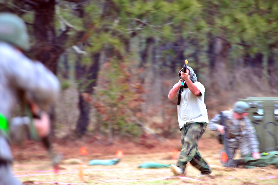 SHAW AIR FORCE BASE, S.C. -- Staff Sgt. William Self, 20th Maintenance Operations Squadron and a member of the exercise evaluation team, runs into the fictional deployed location for an attack during the phase II operational readiness exercise here Feb. 9. The EET is responsible for aiding in the setup, supervision and grading of training scenarios. Shaw performs routine exercises throughout the year to ensure Airmen are ready for base or deployment attacks. (U.S. Air Force photo/Airman 1st Class Amber E. N. Jacobs)