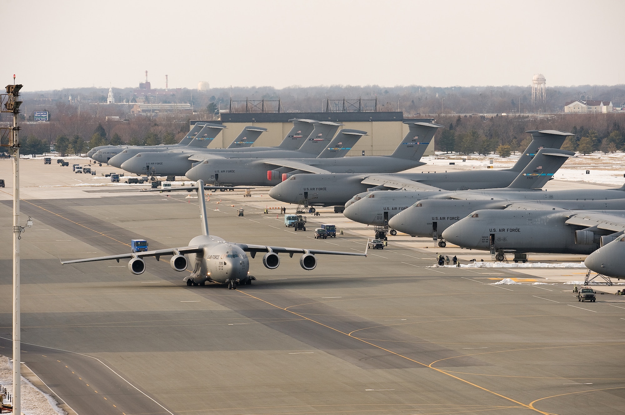 A C-17 Globemaster III taxis at Dover Air Force Base Feb. 4, prior to departing the installation.  Team Dover launched most of the aircraft at the installation prior to a major snow storm hitting the region Feb. 6.  Missions for the aircraft ranged from supporting humanitarian relief efforts in Haiti to delivering cargo to servicemembers deployed to Southwest Asia. (U.S. Air Force photo/Jason Minto)