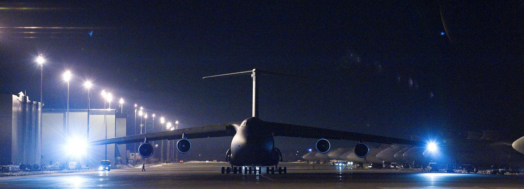 A C-5 Galaxy taxis on the parking ramp at Dover Air Force Base Feb. 4, before taking off.  Team Dover launched nearly all aircraft before a snow storm hit the region Feb. 6. (U.S. Air Force photo/Jason Minto)