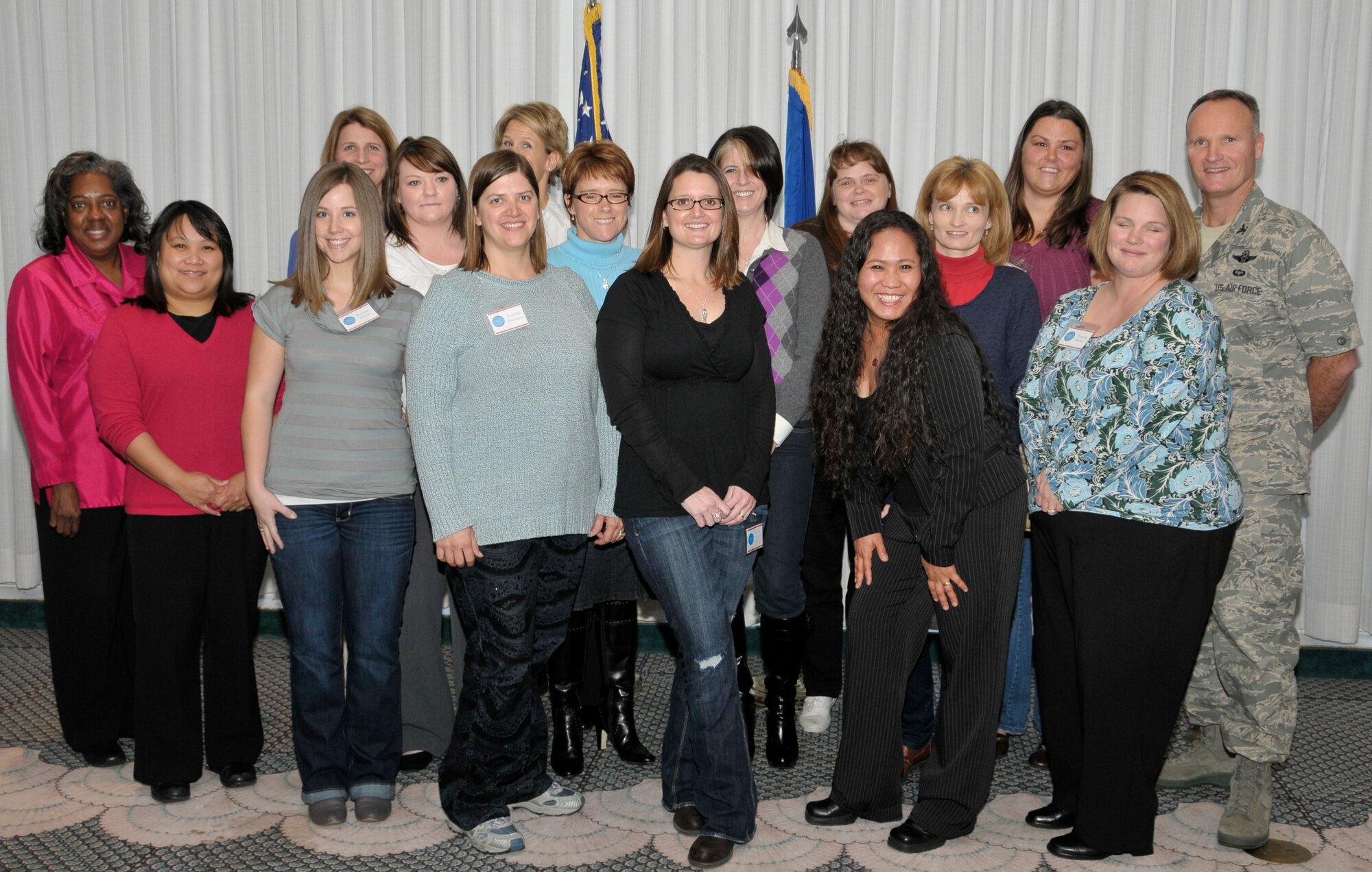 Twelve Key Spouse program members graduated from training Feb. 9 at the Heritage Club during the Heart Link seminar. (U.S. Air Force photo by Lisa Norman)
