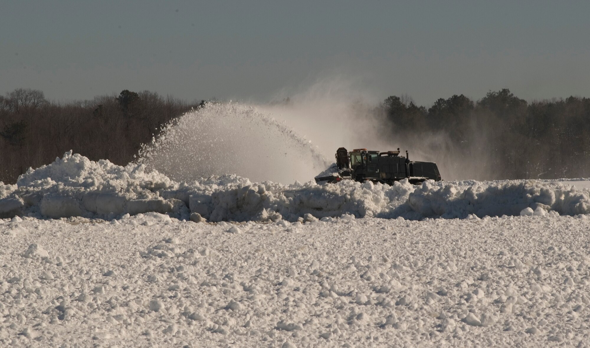 A snow blower removes snow from the flightline at Dover Air Force Base Feb. 8.  Crews worked to remove snow and keep the runways operational at Dover AFB after a snowstorm blanketed the area Feb. 6.  (U.S. Air Force photo/1st Lt. Brian Maguire)