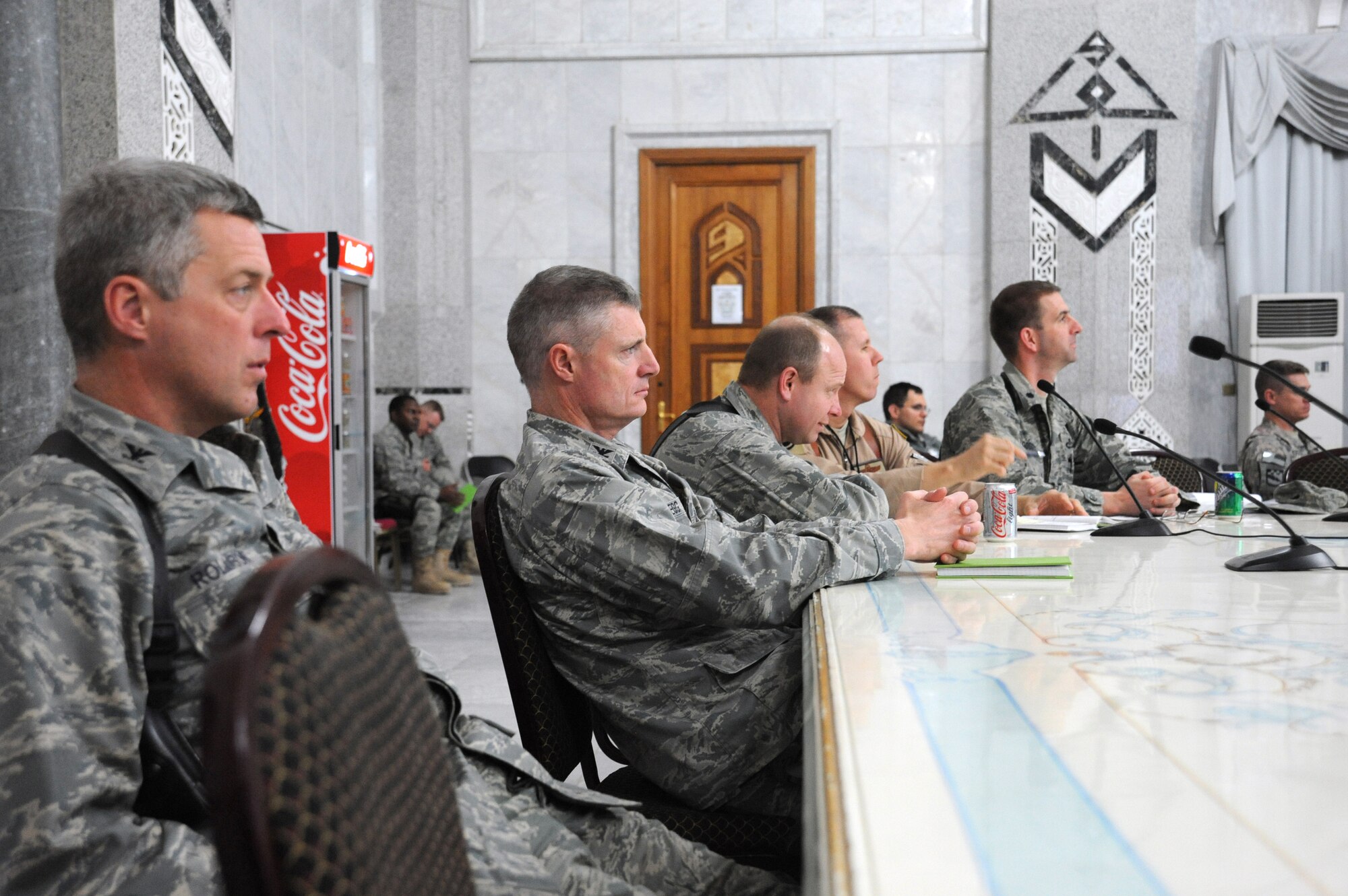 Air Force Col.’s Mike Rollison, Steve Gregg, and Brian Brandner, all Air Component Coordination Element air space planners, intensely listen to the discussions during the AFCENT Iraq Drawdown Conference in the Al Faw palace, Camp Victory, Iraq, Feb. 10, 2009. The purpose of the conference is to bring United States Forces-Iraq and Air Force Central Command planners together to discuss the Air Force's responsible drawdown plans. (U.S. Air Force photo/Master Sgt. Trish Bunting/Released)