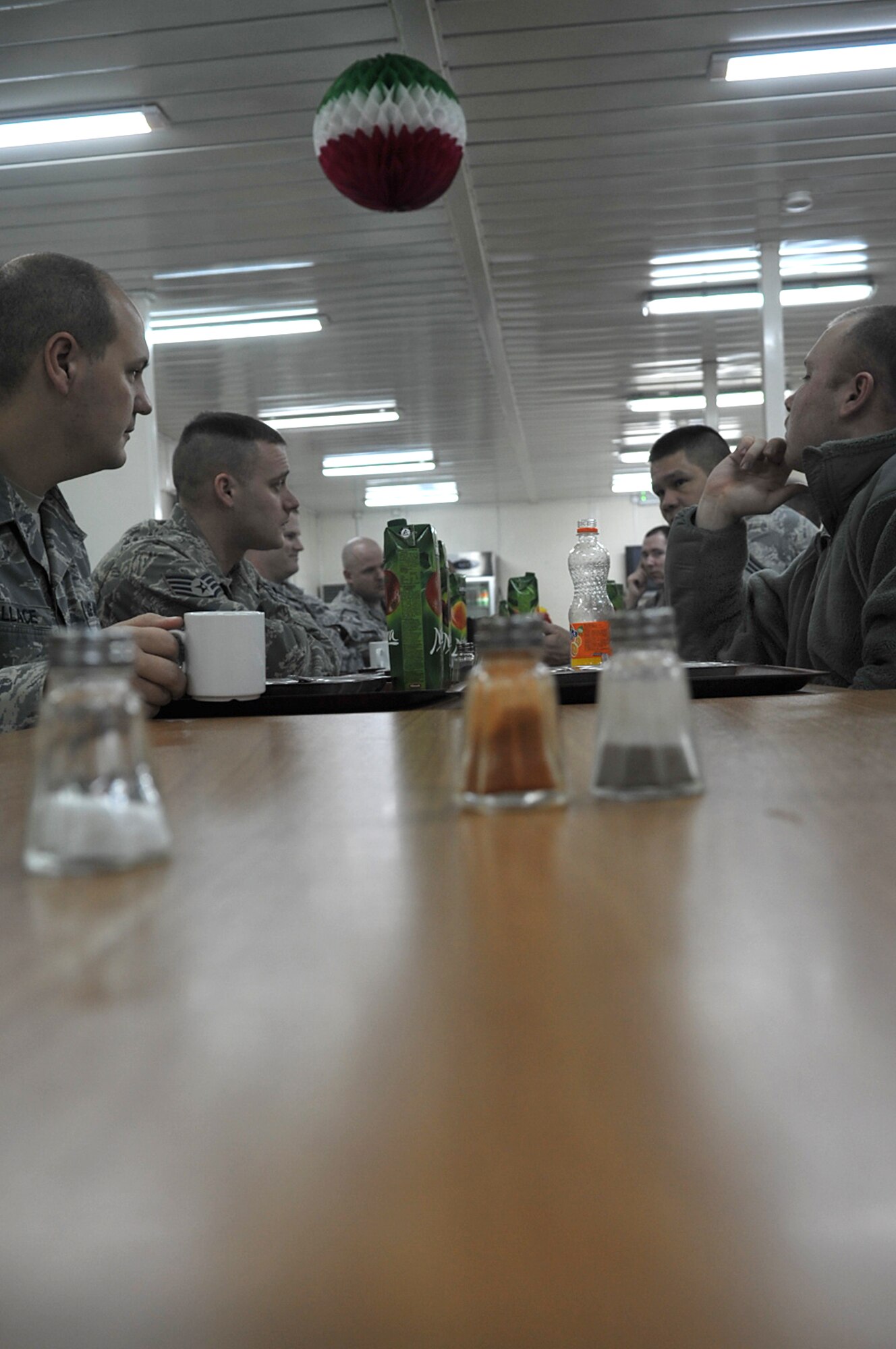 U.S. Air Force members with the 1st Combat Communications Squadron sit down to breakfast at the start of their day, Krtsanisi National Training Center, Georgia, Feb. 9, 2010. The members are  deployed to the Republic of Georgia to provide tactical communication support to the Marine Corps Training and Advisory Group as they teach combat skills to Georgian soldiers preparing to deploy to Afghanistan. (U.S. Air Force photo by Senior Airman Tony R. Ritter)