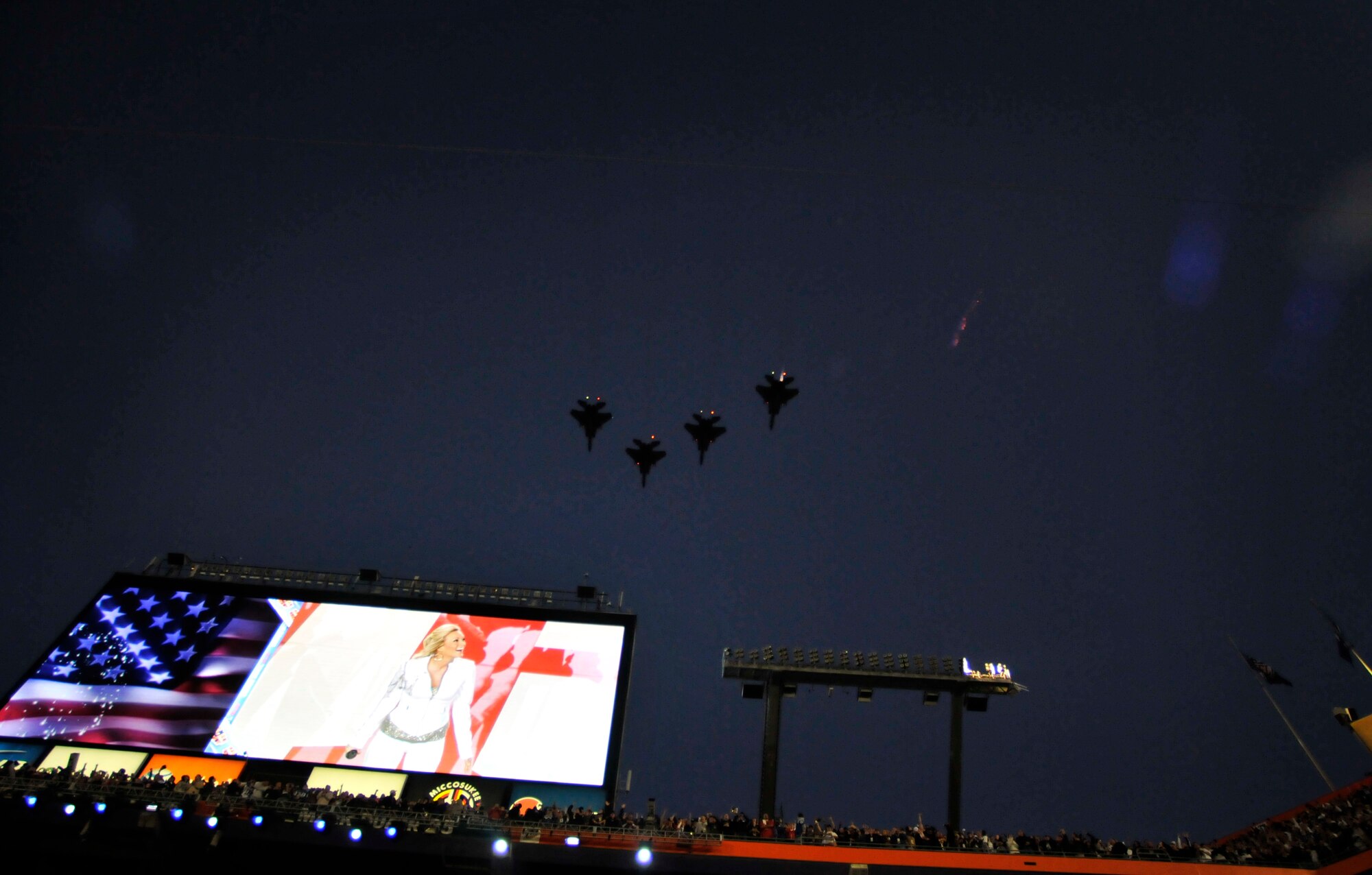 Four F-15 Eagles piloted by 125th Fighter Wing Commander Col. Bob "Squirt" Branyon, 125th Fighter Wing Chief of Stand Eval. Lt. Col. John "Homer" Black, 125th Fighter Wing Operations Group Commander, Col. Bill "Yogi" Bair, and 125th Fighter Squadron Commander, Lt. Col. Mike "Speedo" Rouse fly a historic flight over Sun Life Stadium for Superbowl XLIV, February 7, 2010.The 125th Fighter Wing's participation marked the first Air National Guard flyover in the history of the Super Bowl. (USAF Photo by TSgt. Shelley Gill)