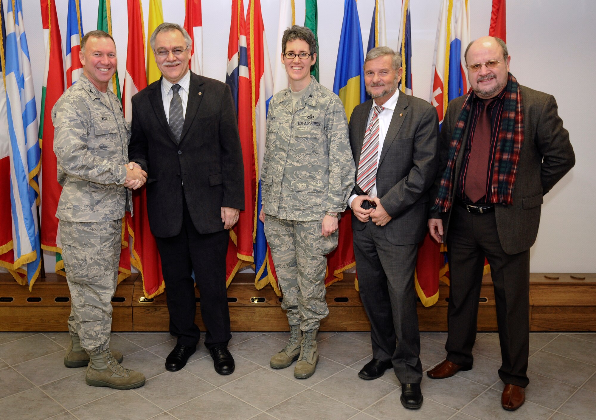 SPANGDAHLEM AIR BASE, Germany – Col. Tip Wight, 52nd Fighter Wing commander, shakes hands with Rheinland-Pfalz Minister of the Interior Karl-Peter Bruch during his visit here Feb. 9. Minister Bruch toured the base and spoke to members of the Spangdahlem AB works council. Also pictured is Col. Jodine Tooke, 52nd Mission Support Group commander; Peter Gruessner, head of department disaster control, civil defense and armed forces; and retired German Bundeswehr Col. Claus Rosenbauer, military advisor to the ministry. (U.S. Air Force photo/Senior Airman Nathanael Callon)