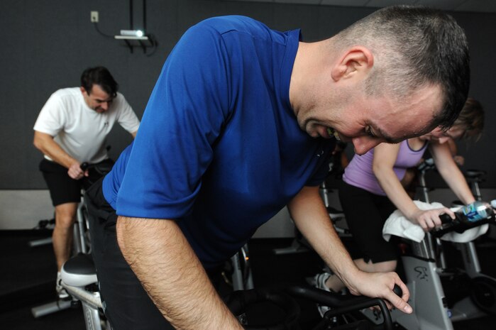 U.S. Air Force Tech. Sgt. Louis Gosseck gives it his all during the last minutes of a 45-minute spin class at the Fitness and Sports Center here Feb. 5, 2010. Spin classes are held at the fitness center Mondays through Fridays. Sergeant Gosseck is an electrical environmental specialist with 437th Aircraft Maintenance Squadron. (U.S. Air Force photo/James M. Bowman)