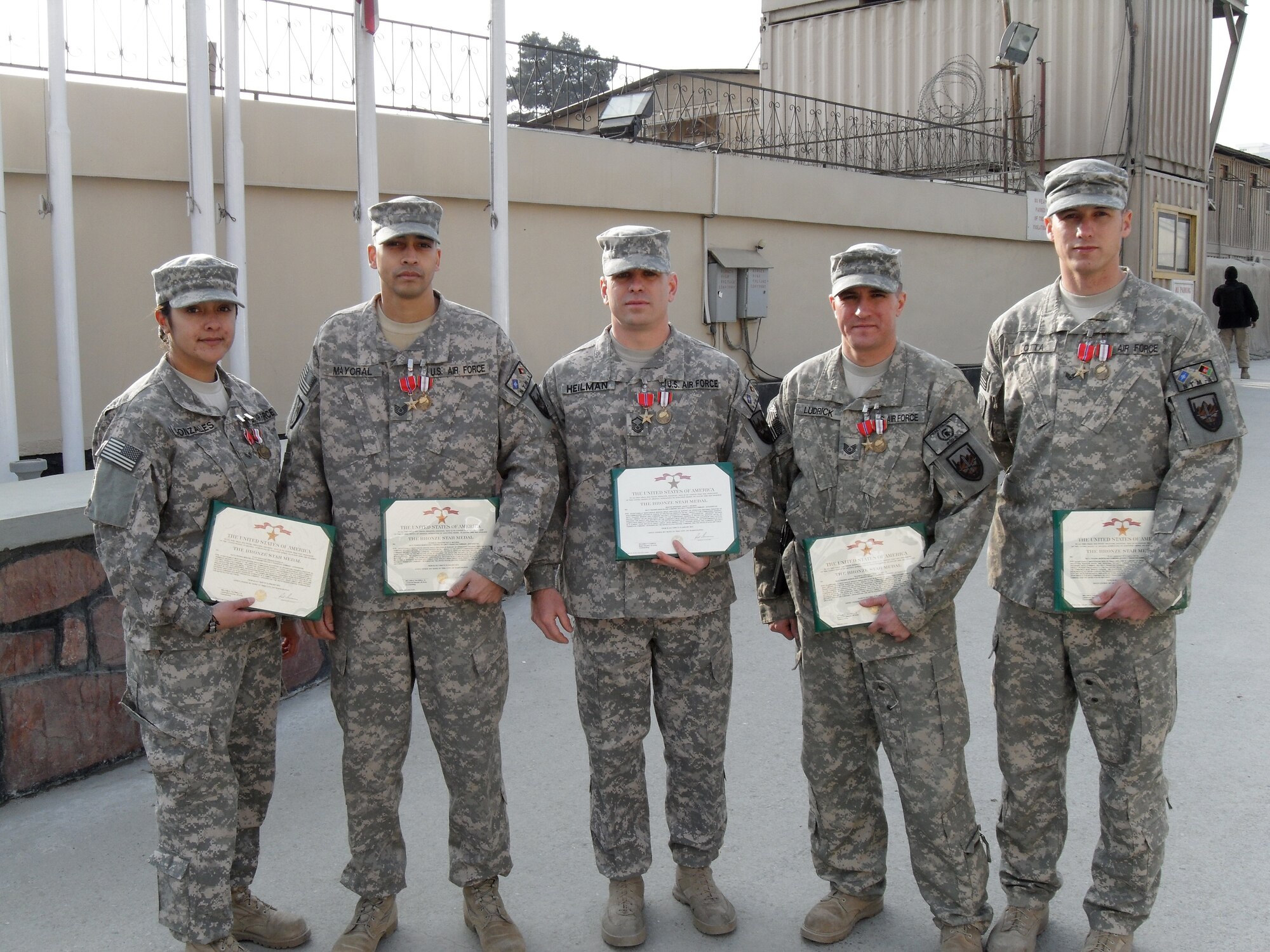 Deployed Airmen from the 86th Security Forces Squadron, led by Master Sgt. Jason Heilman, display their medals. The team received 13 various decorations while providing personal protection for senior military members. The team was recently welcomed home from Camp Eggers, Afghanistan. (Courtesy photo)