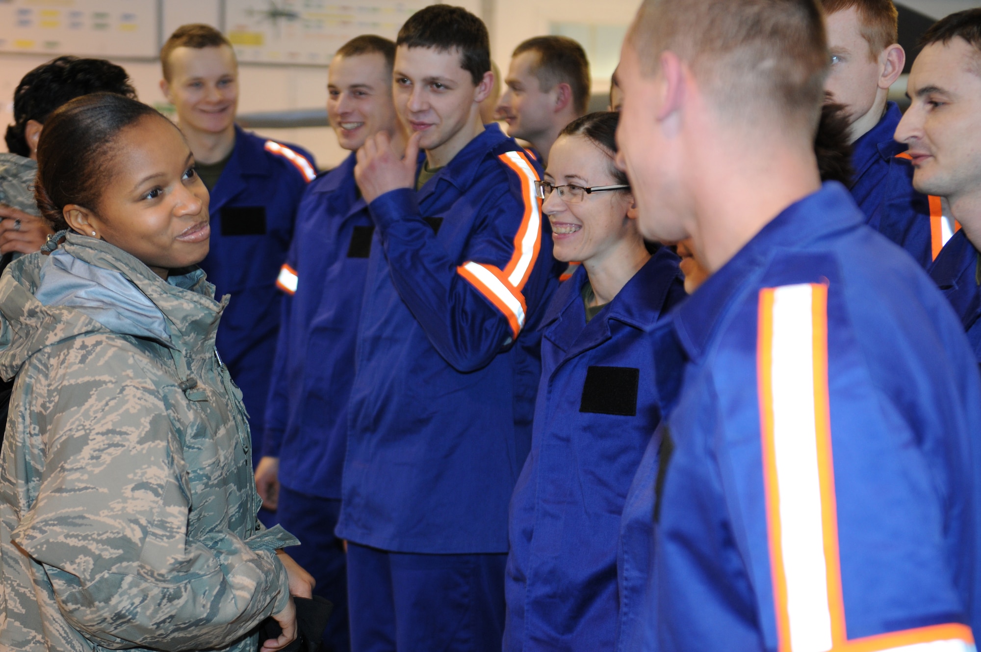 Master Sgt. Tarmeka Lopes, an instructor at the Kisling NCO Academy, talks to Polish airmen attending technical training at the Polish Air Force Academy in Deblin, Poland, Jan 12. (U.S. Air Force Photo by Master Sgt. Gino Mattorano)