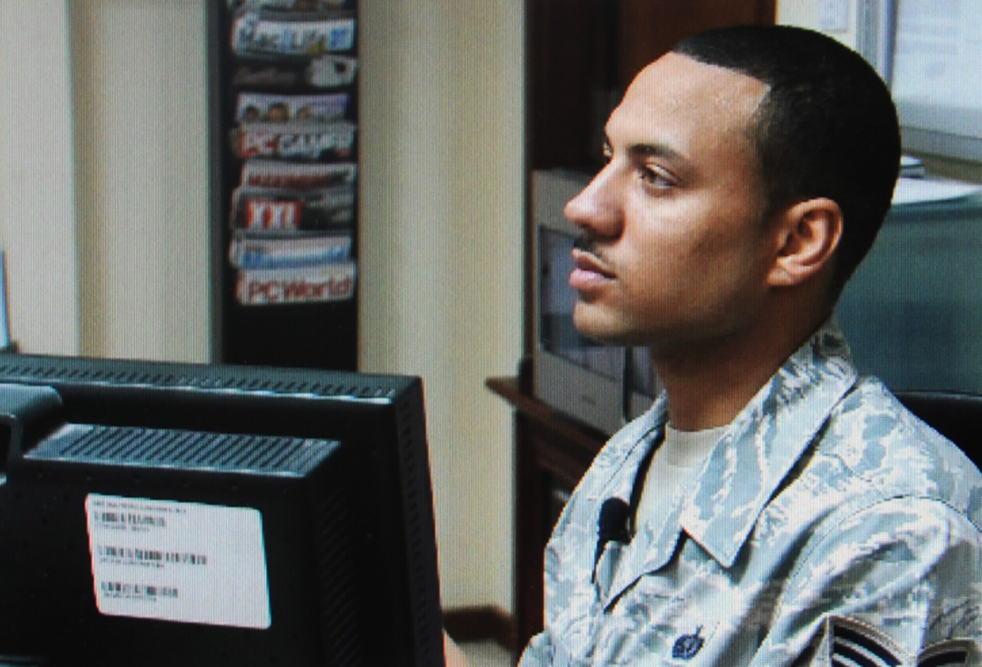 Staff Sgt. Michael Sala, a services craftsman deployed with the 380th Expeditionary Force Support Squadron, helps a customer while managing activities for the 380th Air Expeditionary Wing Learning Resources Center at a non-disclosed base in Southwest Asia on Feb. 10, 2010. He is deployed from the 87th FSS at Joint Base McGuire-Dix-Lakehurst, N.J., and his hometown is Bronx, N.Y.  (U.S. Air Force Photo/Staff Sgt. Nathan Delgado/Released)