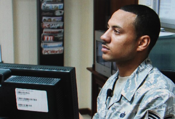 Staff Sgt. Michael Sala, a services craftsman deployed with the 380th Expeditionary Force Support Squadron, helps a customer while managing activities for the 380th Air Expeditionary Wing Learning Resources Center at a non-disclosed base in Southwest Asia on Feb. 10, 2010. He is deployed from the 87th FSS at Joint Base McGuire-Dix-Lakehurst, N.J., and his hometown is Bronx, N.Y.  (U.S. Air Force Photo/Staff Sgt. Nathan Delgado/Released)