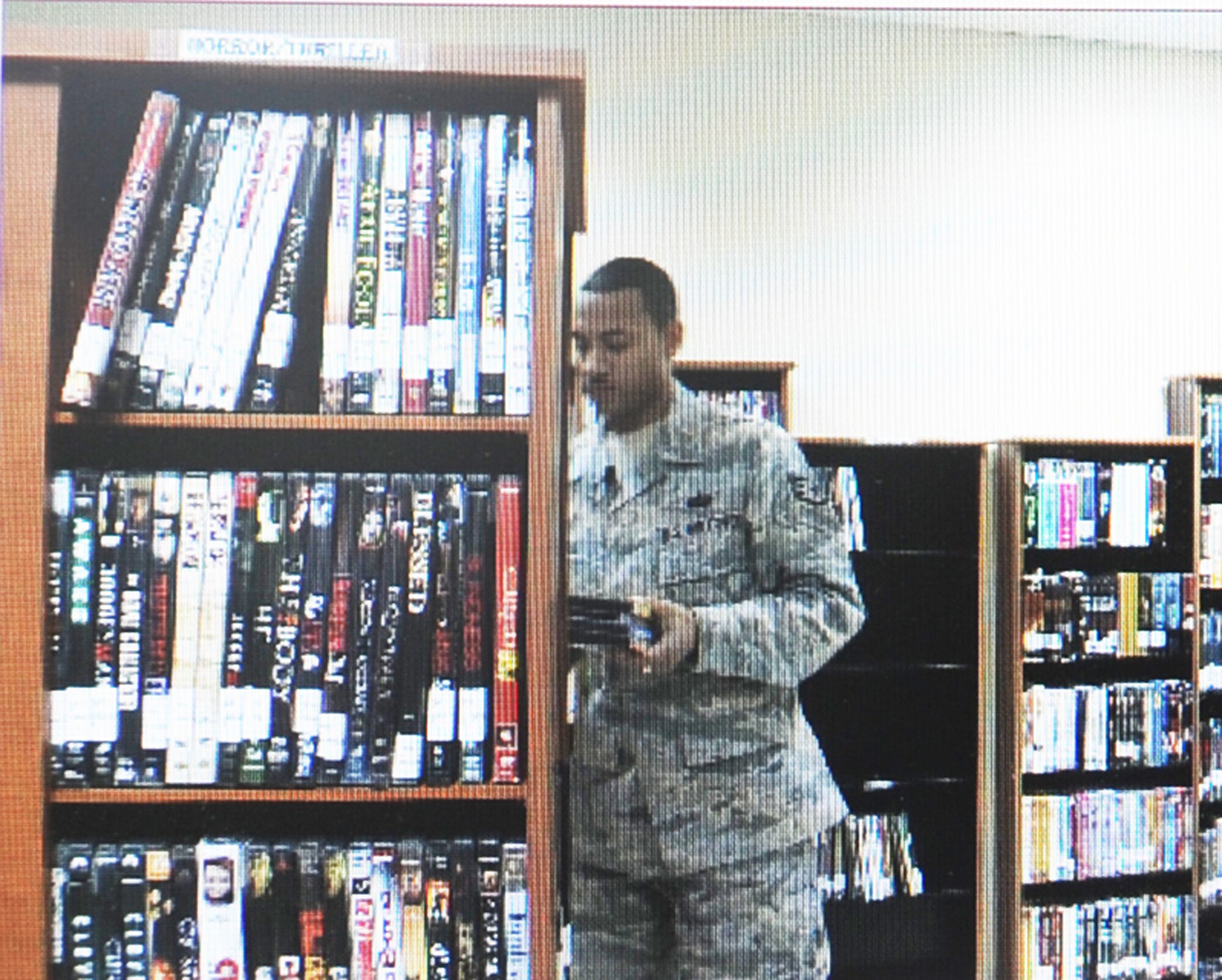 Staff Sgt. Michael Sala, a services craftsman deployed with the 380th Expeditionary Force Support Squadron, puts away movies while managing activities for the 380th Air Expeditionary Wing Learning Resources Center at a non-disclosed base in Southwest Asia on Feb. 10, 2010. He is deployed from the 87th FSS at Joint Base McGuire-Dix-Lakehurst, N.J., and his hometown is Bronx, N.Y.  (U.S. Air Force Photo/Staff Sgt. Nathan Delgado/Released)