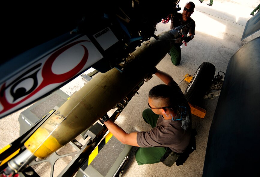Japanese maintenance crew members T/Sgt Kenioki Sakamoto(left) and T/Sgt Hiroshi Saito, 8th Combat Wing, 6th TF Squadron, Tsuiki AB, Japan, prepare their F2 for ammunitions during Cope North on Andersen Air Force Base, Guam on Feb. 9, 2010. The United States Air Force and the Japanese Air Self-Defense Force conduct Cope North annually to increase combat readiness and interoperability, concentrating on coordination and evaluation of air tactics, techniques, and procedures. The ability for both nations to work together increases their preparedness to support real-world contingencies.(USAF photo by Staff Sgt. Andy M. Kin)