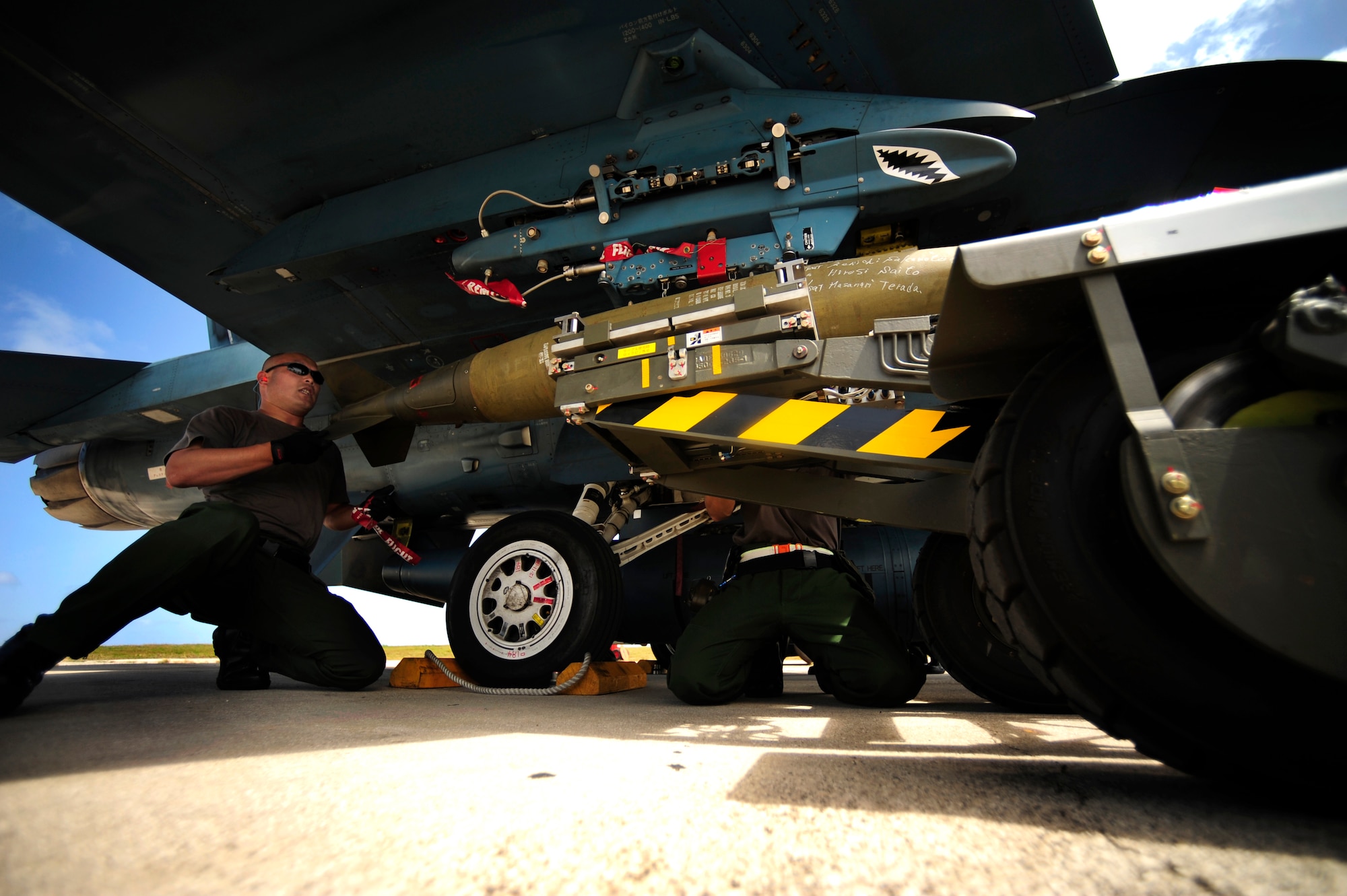 Japanese maintenance crew members T/Sgt Kenioki Sakamoto(left) and T/Sgt Hiroshi Saito, 8th Combat Wing, 6th TF Squadron, Tsuiki AB, Japan, prepare their F2 for ammunitions during Cope North on Andersen Air Force Base, Guam on Feb. 9, 2010. The United States Air Force and the Japanese Air Self-Defense Force conduct Cope North annually to increase combat readiness and interoperability, concentrating on coordination and evaluation of air tactics, techniques, and procedures. The ability for both nations to work together increases their preparedness to support real-world contingencies.
(USAF photo by Staff Sgt. Andy M. Kin)
