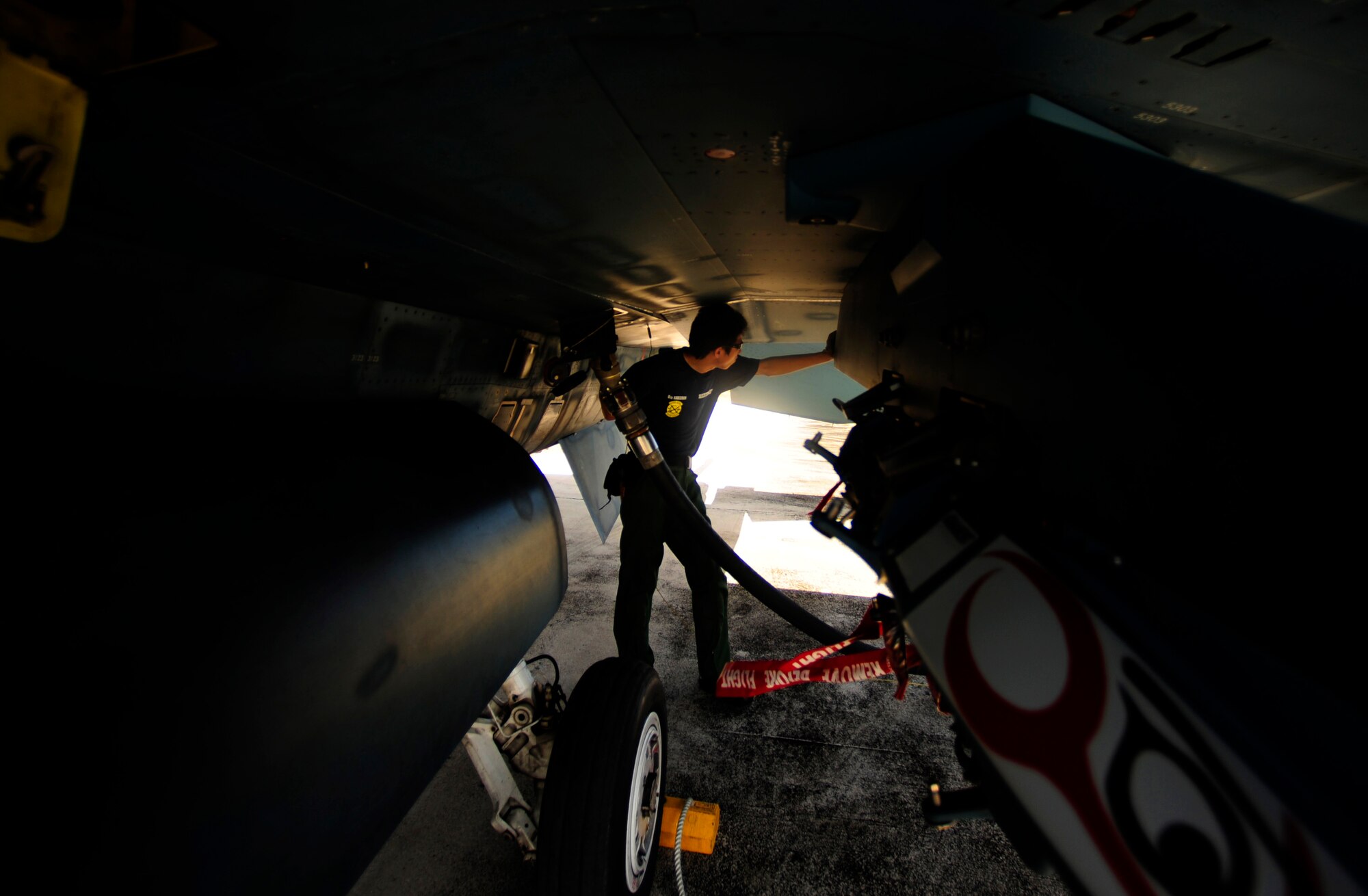 Japanese maintenance crew member of the 8th Combat Wing, 6th TF Squadron, Tsuiki AB, Japan, fuels Japanese F2 during Cope North on Andersen Air Force Base, Guam on Feb. 9, 2010. The United States Air Force and the Japanese Air Self-Defense Force conduct Cope North annually to increase combat readiness and interoperability, concentrating on coordination and evaluation of air tactics, techniques, and procedures. The ability for both nations to work together increases their preparedness to support real-world contingencies.
(USAF photo by Staff Sgt. Andy M. Kin)
