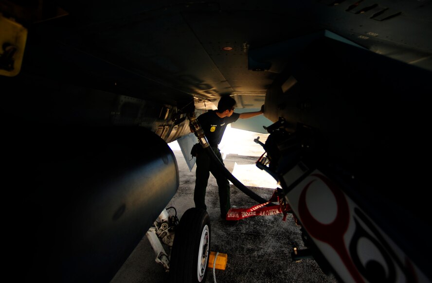 Japanese maintenance crew member of the 8th Combat Wing, 6th TF Squadron, Tsuiki AB, Japan, fuels Japanese F2 during Cope North on Andersen Air Force Base, Guam on Feb. 9, 2010. The United States Air Force and the Japanese Air Self-Defense Force conduct Cope North annually to increase combat readiness and interoperability, concentrating on coordination and evaluation of air tactics, techniques, and procedures. The ability for both nations to work together increases their preparedness to support real-world contingencies.(USAF photo by Staff Sgt. Andy M. Kin)