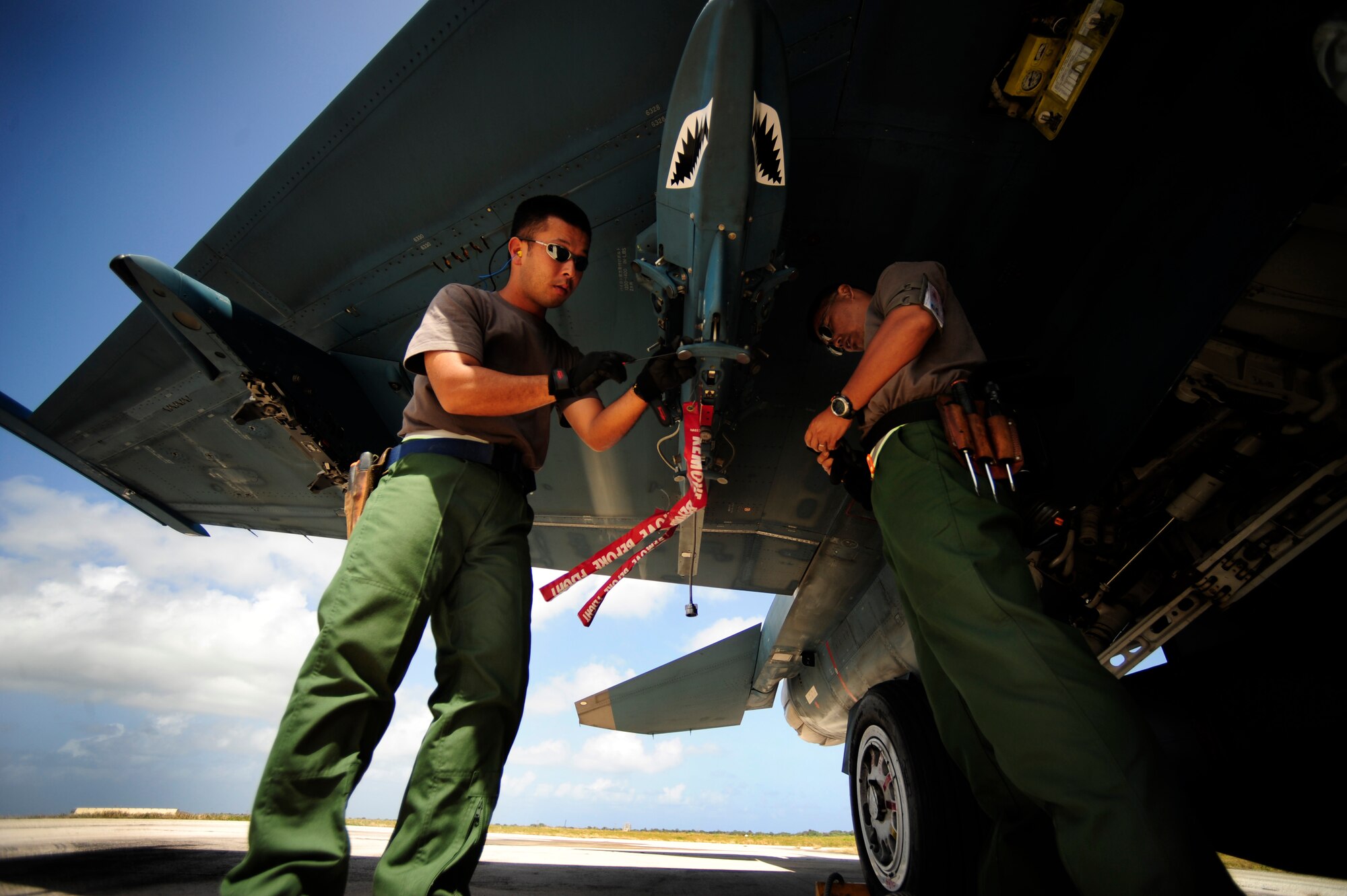 Japanese maintenance crew members of the 8th Combat Wing, 6th TF Squadron, Tsuiki AB, Japan, prepare their F2 for ammunitions during Cope North on Andersen Air Force Base, Guam on Feb. 9, 2010. The United States Air Force and the Japanese Air Self-Defense Force conduct Cope North annually to increase combat readiness and interoperability, concentrating on coordination and evaluation of air tactics, techniques, and procedures. The ability for both nations to work together increases their preparedness to support real-world contingencies.
(USAF photo by Staff Sgt. Andy M. Kin)
