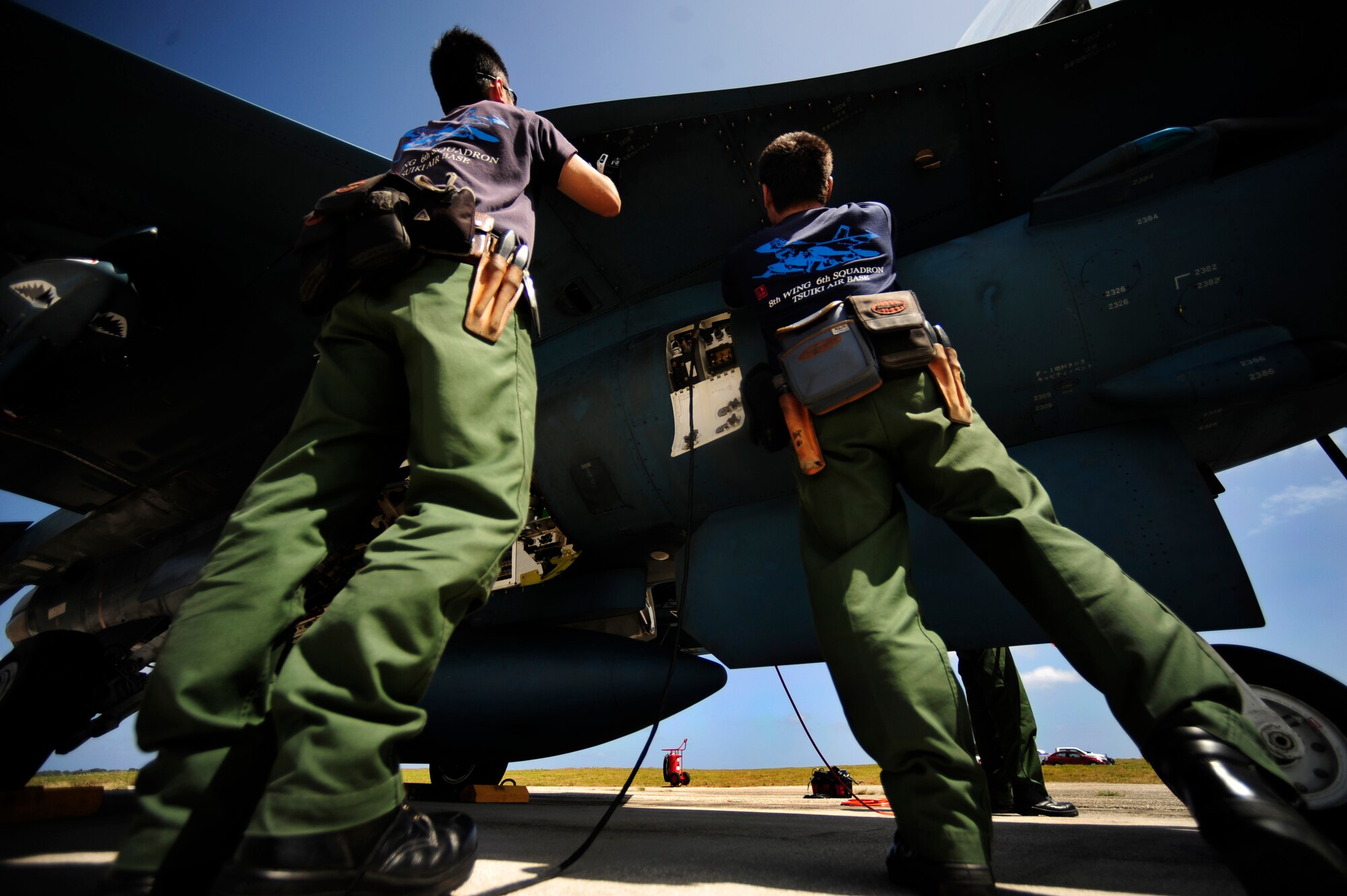 Japanese crew members of the 8th Combat Wing, 6th TF Squadron, Tsuiki AB, Japan, prepare their F2 for ammunitions during Cope North on Andersen Air Force Base, Guam on Feb. 9, 2010.The United States Air Force and the Japanese Air Self-Defense Force conduct Cope North annually to increase combat readiness and interoperability, concentrating on coordination and evaluation of air tactics, techniques, and procedures. The ability for both nations to work together increases their preparedness to support real-world contingencies.
(USAF photo by Staff Sgt. Andy M. Kin)

