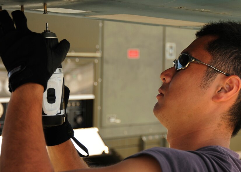 Japanese maintenance crew member of the 8th Combat Wing, 6th TF Squadron, Tsuiki AB, Japan, prepare their F2 for ammunitions during Cope North on Andersen Air Force Base, Guam on Feb. 9, 2010. The United States Air Force and the Japanese Air Self-Defense Force conduct Cope North annually to increase combat readiness and interoperability, concentrating on coordination and evaluation of air tactics, techniques, and procedures. The ability for both nations to work together increases their preparedness to support real-world contingencies.(USAF photo by Staff Sgt. Andy M. Kin)