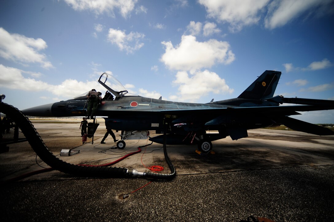 Japanese maintenance crew of the 8th Combat Wing, 6th TF Squadron, Tsuiki AB, Japan, prepare their F2 for ammunitions during Cope North on Andersen Air Force Base, Guam on Feb. 9, 2010. The United States Air Force and the Japanese Air Self-Defense Force conduct Cope North annually to increase combat readiness and interoperability, concentrating on coordination and evaluation of air tactics, techniques, and procedures. The ability for both nations to work together increases their preparedness to support real-world contingencies.
(USAF photo by Staff Sgt. Andy M. Kin)
