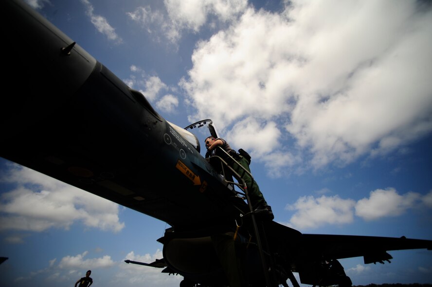 T/Sgt. Kenioki Sakamoto of the 8th Combat Wing, 6th TF Squadron, Tsuiki AB, Japan, prepare their F2 for ammunitions during Cope North on Andersen Air Force Base, Guam on Feb. 9, 2010. The United States Air Force and the Japanese Air Self-Defense Force conduct Cope North annually to increase combat readiness and interoperability, concentrating on coordination and evaluation of air tactics, techniques, and procedures. The ability for both nations to work together increases their preparedness to support real-world contingencies.(USAF photo by Staff Sgt. Andy M. Kin)