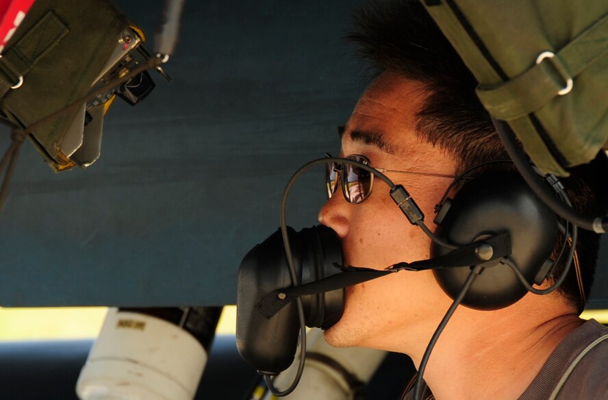 T/Sgt. Hiroshi Saito, 8th Combat Wing, 6th TF Squadron, Tsuiki AB, Japan, works under a F2 Support Fighter during a weapons upload at Cope North, Andersen Air Force Base, Guam on Feb. 9, 2009. The United States Air Force and the Japanese Air Self-Defense Force conduct Cope North annually to increase combat readiness and interoperability, concentrating on coordination and evaluation of air tactics, techniques, and procedures. The ability for both nations to work together increases their preparedness to support real-world contingencies.(USAF photo by Staff Sgt. Andy M. Kin)