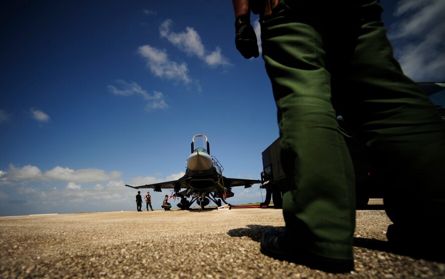 Japanese maintenance crew of the 8th Combat Wing, 6th TF Squadron, Tsuiki AB, Japan, prepare their F2 for ammunitions during Cope North on Andersen Air Force Base, Guam on Feb. 9, 2010. The United States Air Force and the Japanese Air Self-Defense Force conduct Cope North annually to increase combat readiness and interoperability, concentrating on coordination and evaluation of air tactics, techniques, and procedures. The ability for both nations to work together increases their preparedness to support real-world contingencies.(USAF photo by Staff Sgt. Andy M. Kin)