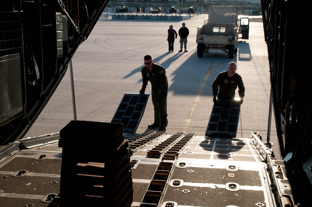 139th Airlift Wing, Mo. Air National Guard, aircrew members, prepare their C-130 at Fort Hood, Tx, for another mission to Port-Au-Prince, Haiti on February 9, 2010. (U.S. Air Force photo by Master Sgt. Shannon Bond/Released)