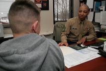 Gunnery Sgt. Ralph Grimes, a prior service recruiter out of Kansas City, Mo., speaks with a former Marine about the oppurtunities in the Marine Corps reserves. Grimes role as a PSR is to find inactive marines who still have the desire to be on active duty and wish to return. The Midwest Marines PSR community received the inaugural Recruiting Excellence Award for Superior Performance by being number one in the nation through mission success and customer satisfaction.