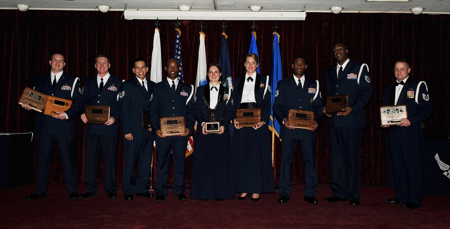 Distinguished graduates of the Joint Service Non-Commissioned Officer Academy pose for a photograph on graduation night at Kadena's Erwin Professional Military Education Center, Feb 11. The Erwin PME Center conducts a leadership course for enlisted servicemembers in the rank of E-6. (U.S. Air Force photo / Senior Airman Amanda N. Grabiec)
