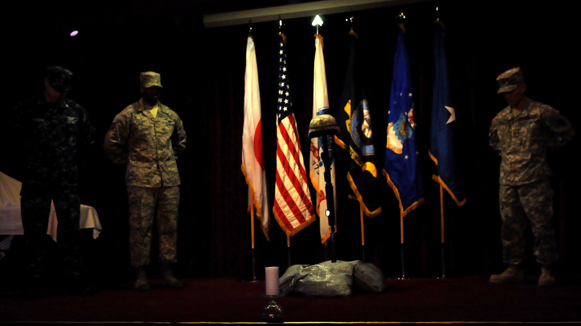Members of the United States Army, Air Force and Navy perform a remembrance vigil at the Joint Service Non-Commissioned Officer Academy graduation at Kadena's Erwin Professional Military Education Center, Feb 11. The Erwin PME Center conducts a leadership course for enlisted servicemembers in the rank of E-6. (U.S. Air Force photo / Senior Airman Amanda N. Grabiec)