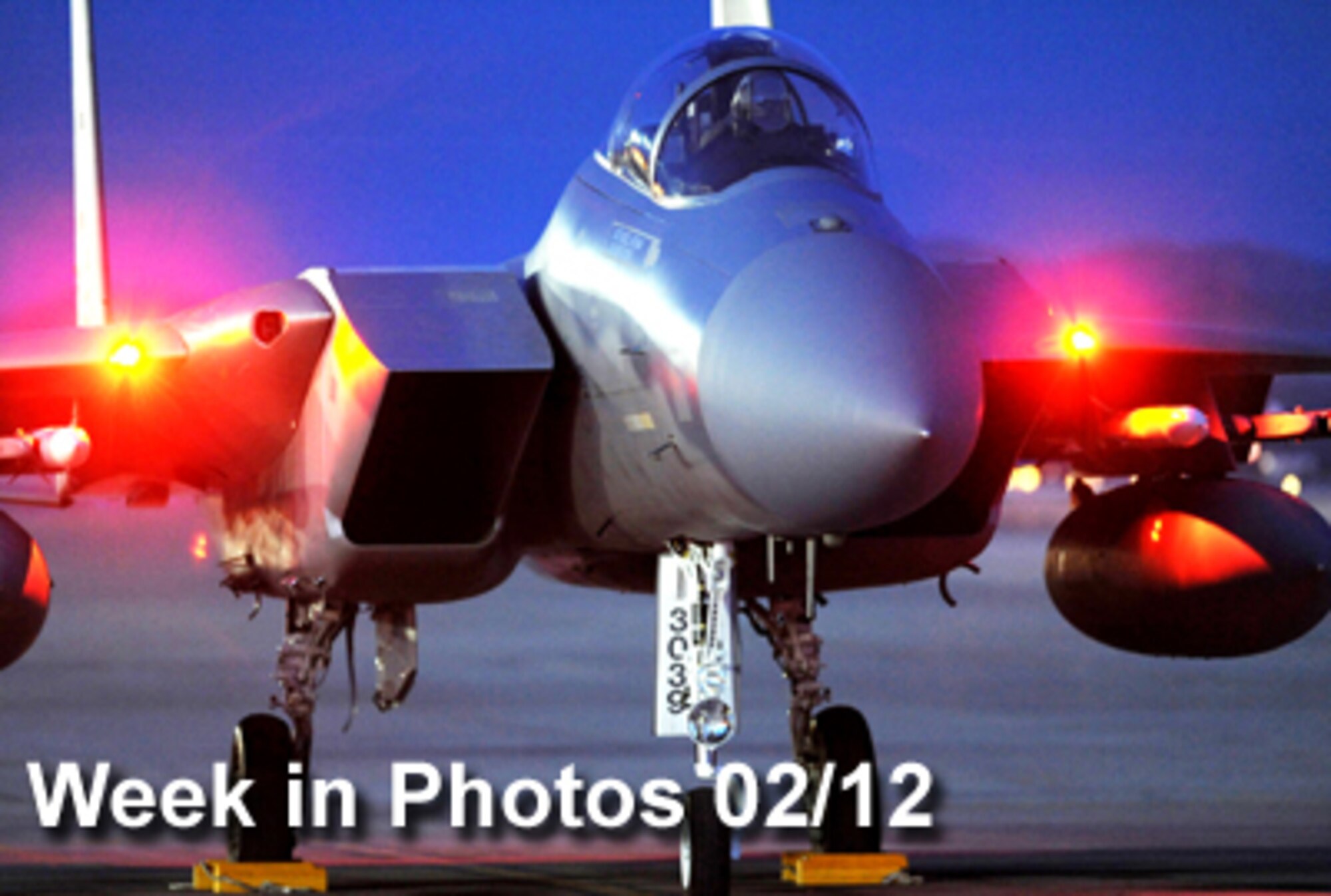 Air Force Week in Photos for Feb. 12, 2010, highlights photos from around the Air Force. In this photo by Tech. Sgt. Michael R. Holzworth, an F-15 Eagle pilot waits for the chocks to be pulled as he prepares for a night training mission Feb. 2, 2010, during Red Flag at Nellis Air Force Base, Nev. (U.S. Air Force photo illustration) 
