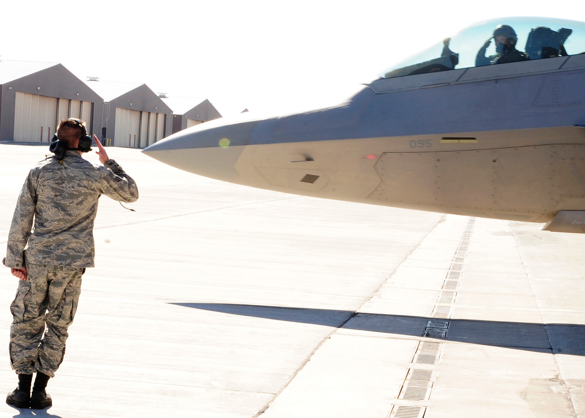 HOLLOMAN AIR FORCE BASE, N.M. -- Col. Kevin "Hollywood" Robbins, 49th Fighter Wing vice commander, returns a final salute to his crew chief before taxiing out for his final flight with the 49th Fighter Wing, Feb. 5. Colonel Robbins is a command pilot with more than 3,600 flight hours in the F-22 Raptor, F-15 Eagle and F-16 Fighting Falcon. He has flown combat missions in support of Operations Desert Storm, Desert Shield and Southern Watch. (U.S. Air Force photo by Senior Airman Deandre Curtiss)