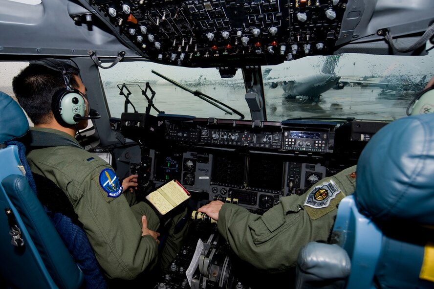 First Lieutenant Andre Dieu, 7th Airlift Squadron, taxis a C-17 Globemaster III to a parking spot on the McChord Field flightline following a training mission Feb.10, 2010. (U.S. Air Force Photo by Abner Guzman)
