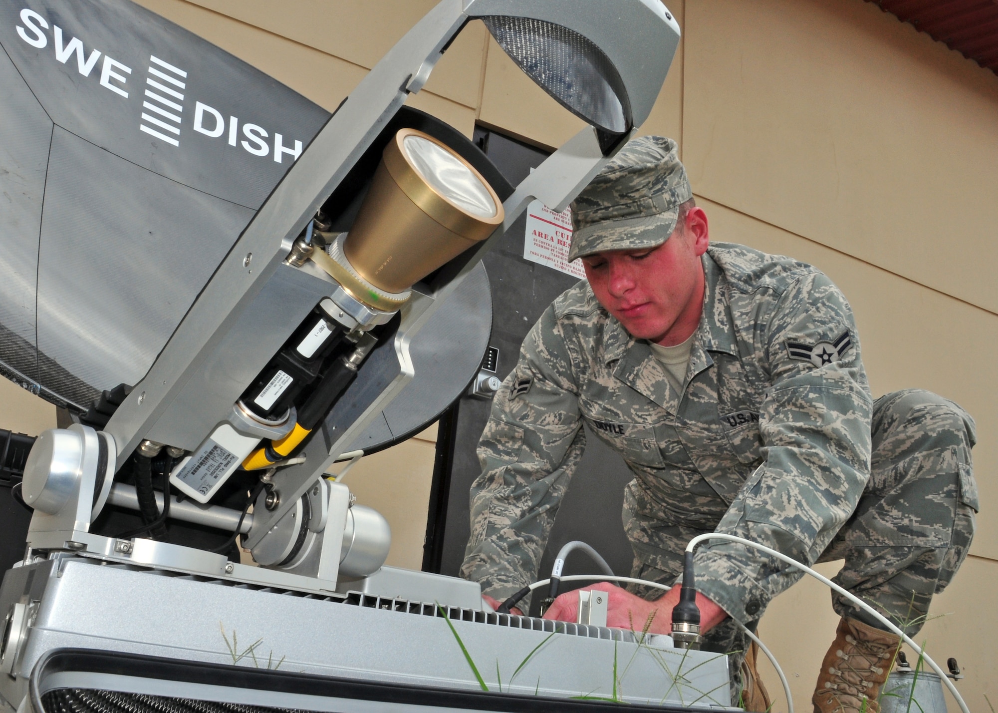 Airman 1st Class William Doyle, Joint Task Force-Bravo, checks the connection to the tactical communication system Feb. 11 at Soto Cano Air Base, Honduras. The system provides command and control the ability to go anywhere anytime and still have the capability to send as well as receive information. (U.S. Air Force Photo/Staff Sgt. Bryan Franks)
