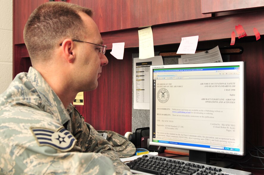 Staff Sgt. Shaun Bassett, 4th Fighter Wing ground safety apprentice, reviews an Air Force Instruction which governs how to perform a safety check before inspecting one of the base fighter squadrons on Seymour Johnson Air Force Base, N.C., Feb. 9, 2010.  If an inspector experiences unfamiliar issue, they seek a resolution in the AFI. Bassett hails from Milltown, Ind. (U.S. Air Force photo/Senior Airman Rae Perry)
