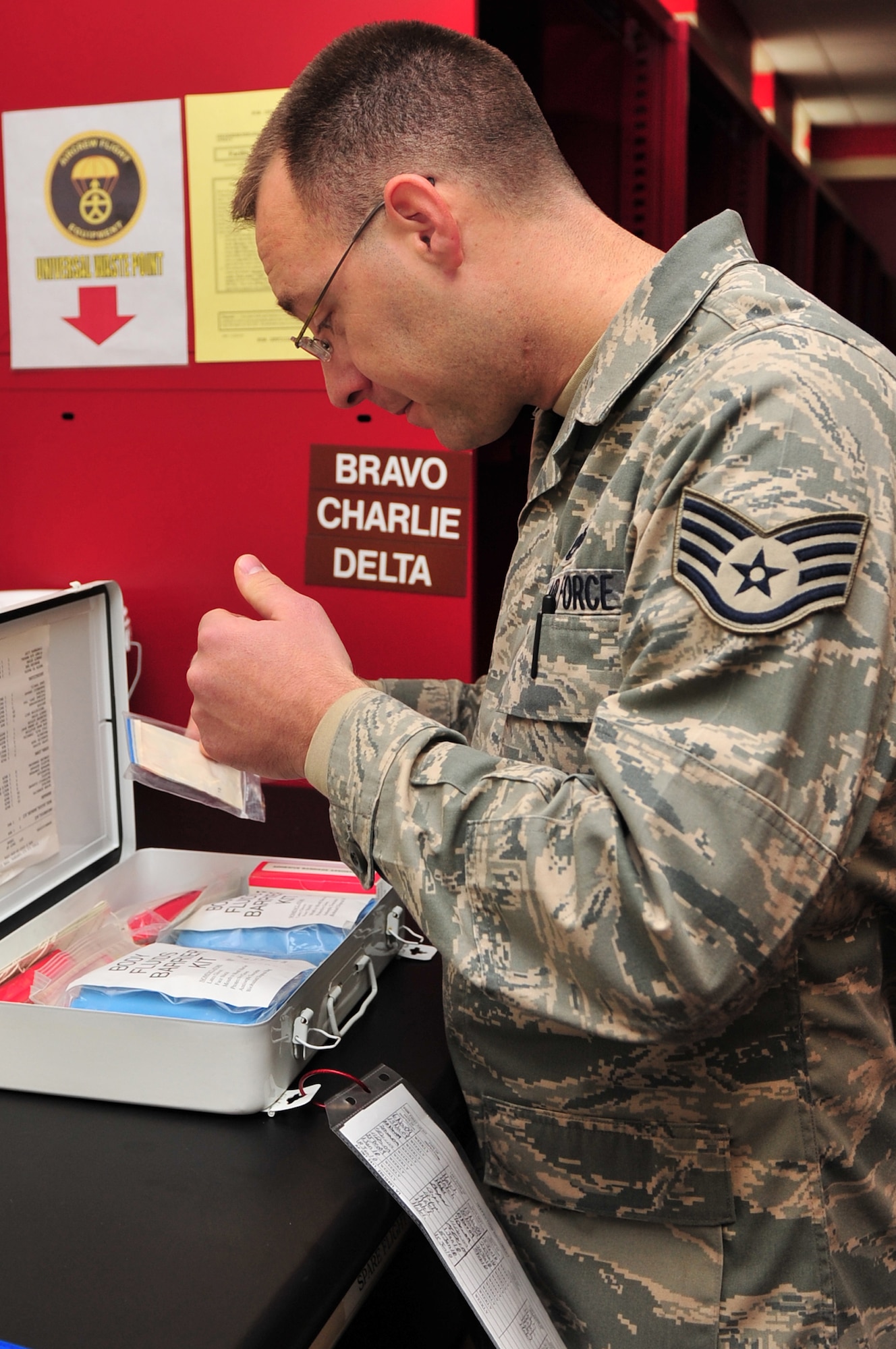 Staff Sgt. Shaun Bassett, 4th Fighter Wing ground safety apprentice, checks a first aid kit expiration date in the 333rd Fighter Squadron's life support section on Seymour Johnson Air Force Base, N.C., Feb. 9, 2010. The first aid kit is one of the things safety personnel check while performing inspections around the base. Bassett is from Milltown, Ind. (U.S. Air Force photo/Senior Airman Rae Perry)