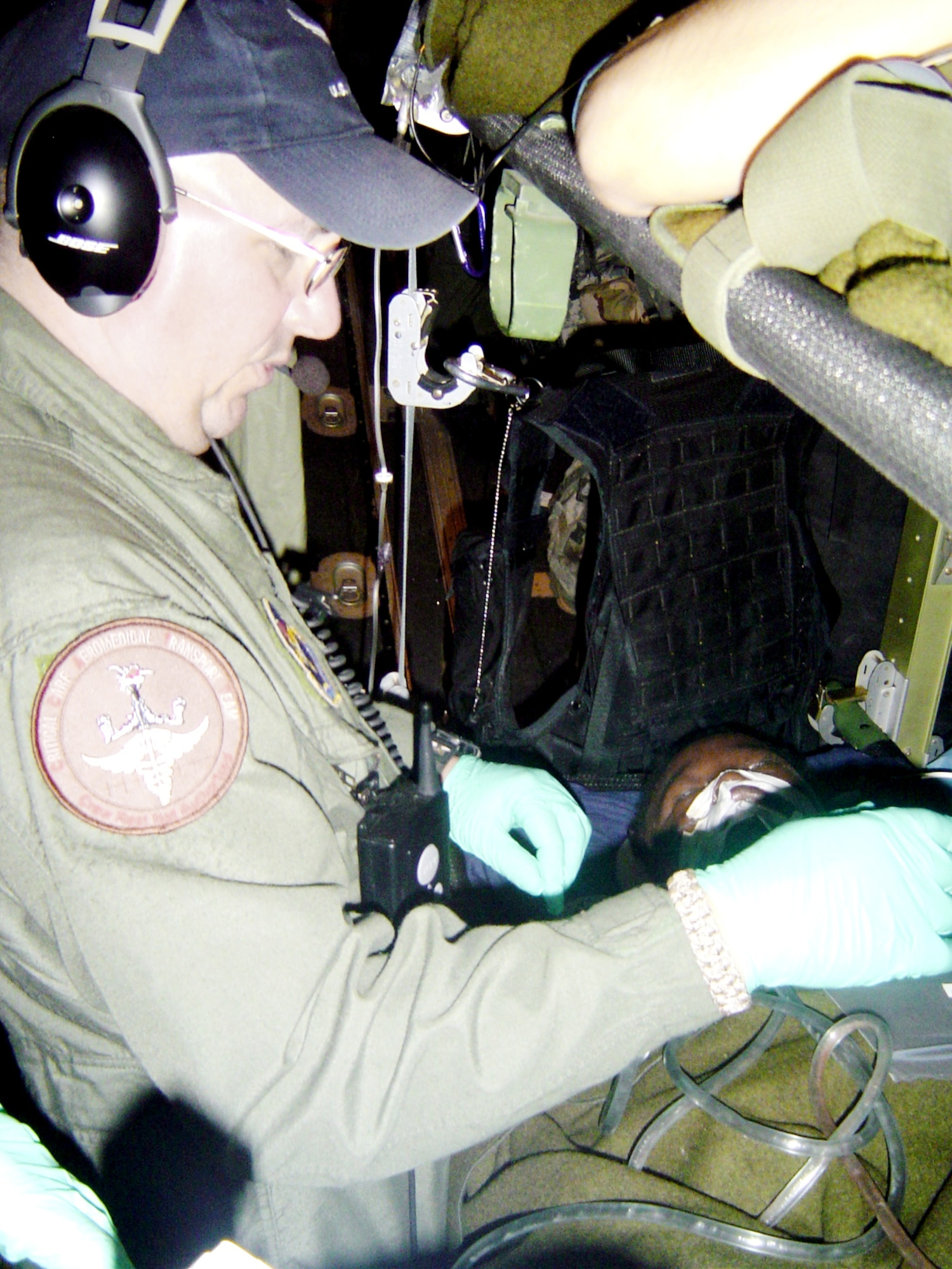 Tech. Sgt. Rich Pakula monitors equipment aboard a C-130 Hercules Feb. 7, 2010. Sergeant Pakula is an 81st Medical Group respiratory therapist from Keesler Air Force Base, Miss. (U.S. Air Force photo/Maj. (Dr.) Stephen Boskovich)
