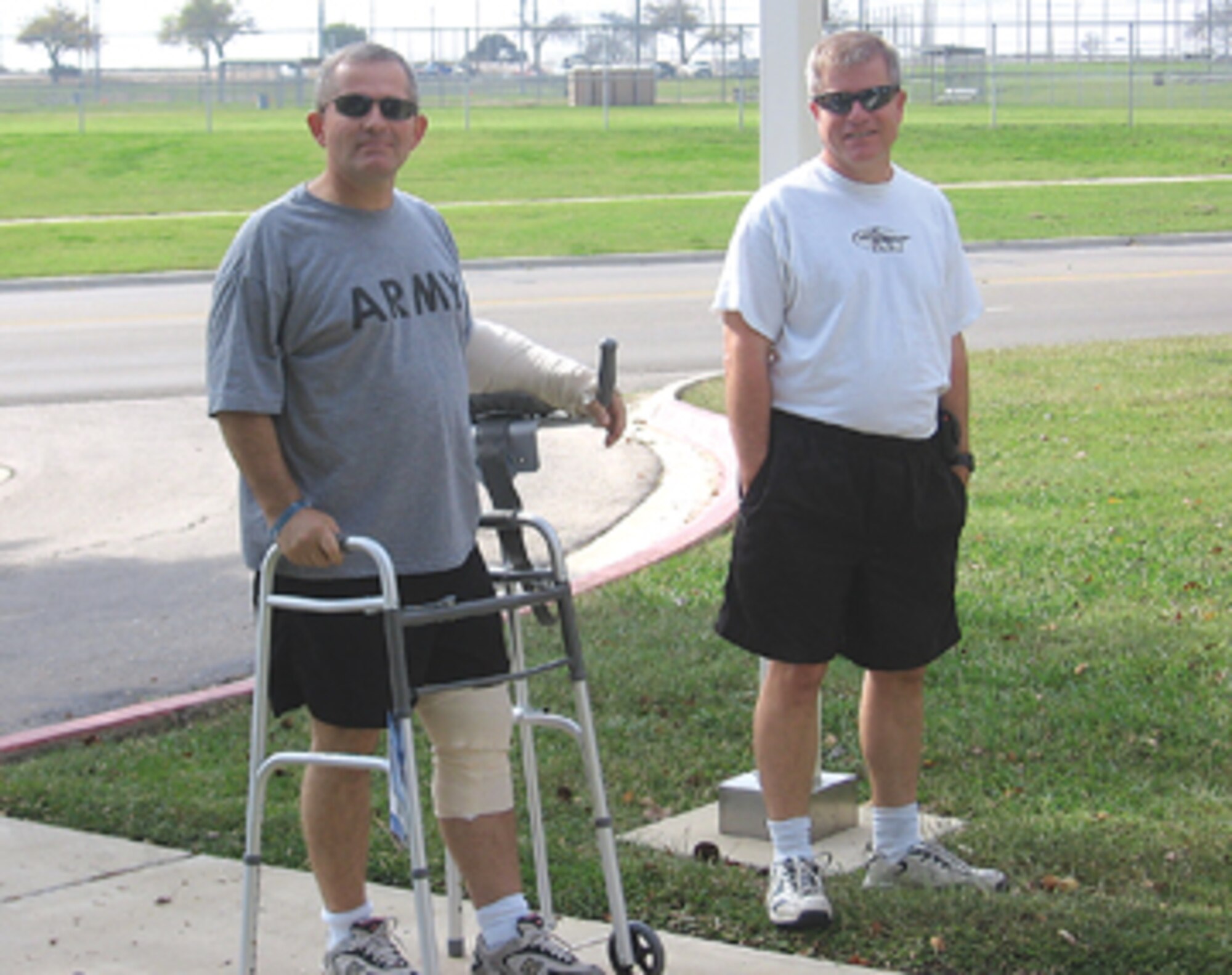 Major Randy Royer of the Alabama Army National Guard takes and his brother, Sergeant David Royer Master Sergeant David Royer of the 908th Airlift Wing, enjoy a walk outdoors during Major Royer’s recuperation following the tragic Nov. 5 shooting at Fort Hood. The major was wounded twice, but pulled to saftey before the gunman could fire again. Sergeant Royer, even after a full day's work, drove 14 hours to Texas to be at his brother's side.