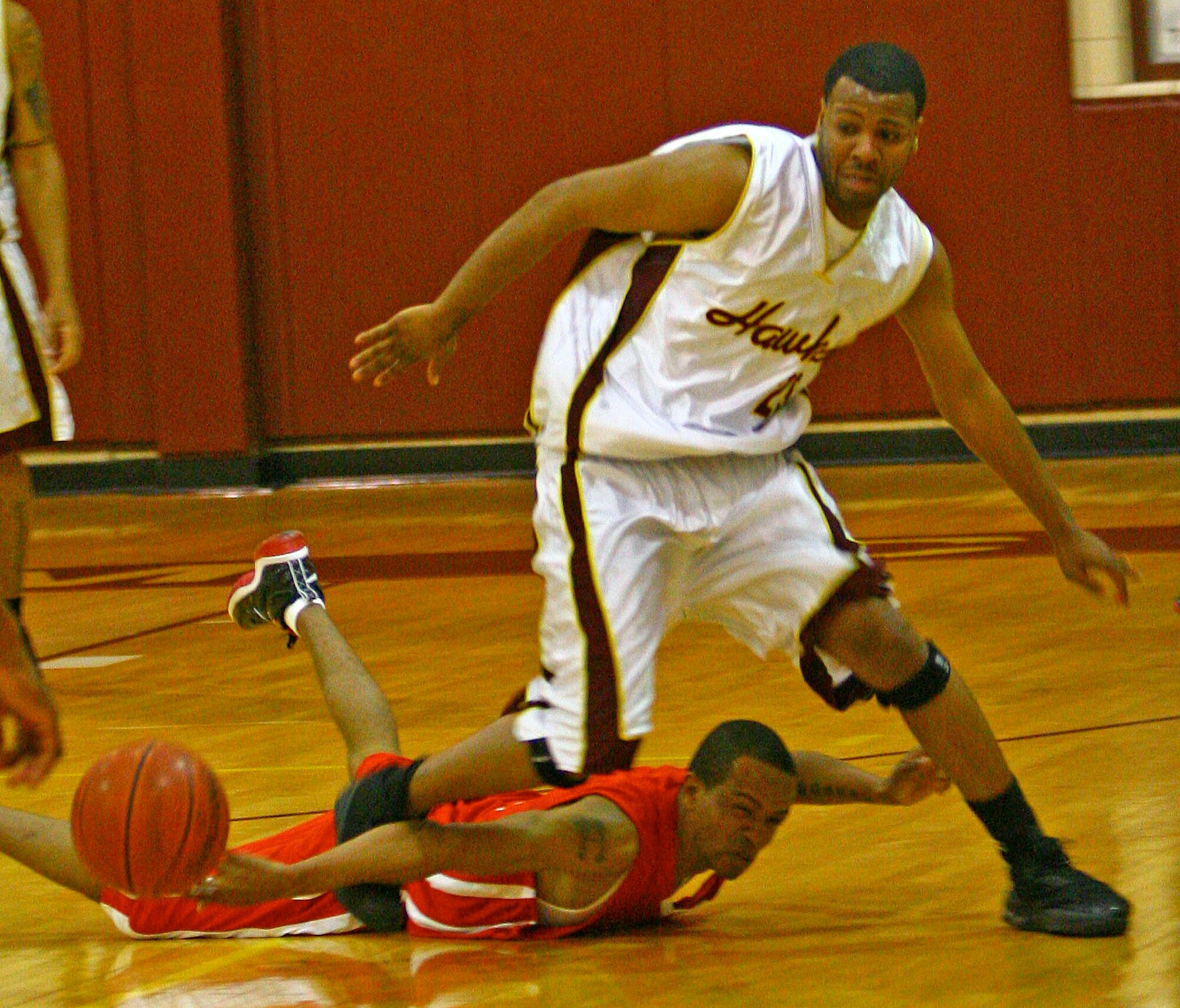 Tinker’s Gerard West goes for a loose ball against a Fort Sill defender Feb. 7. The Hawks bested the Cannoneers 86-81 on Saturday, but fell hard on Sunday in an 89-65 loss. (Air Force photo by John Stuart)