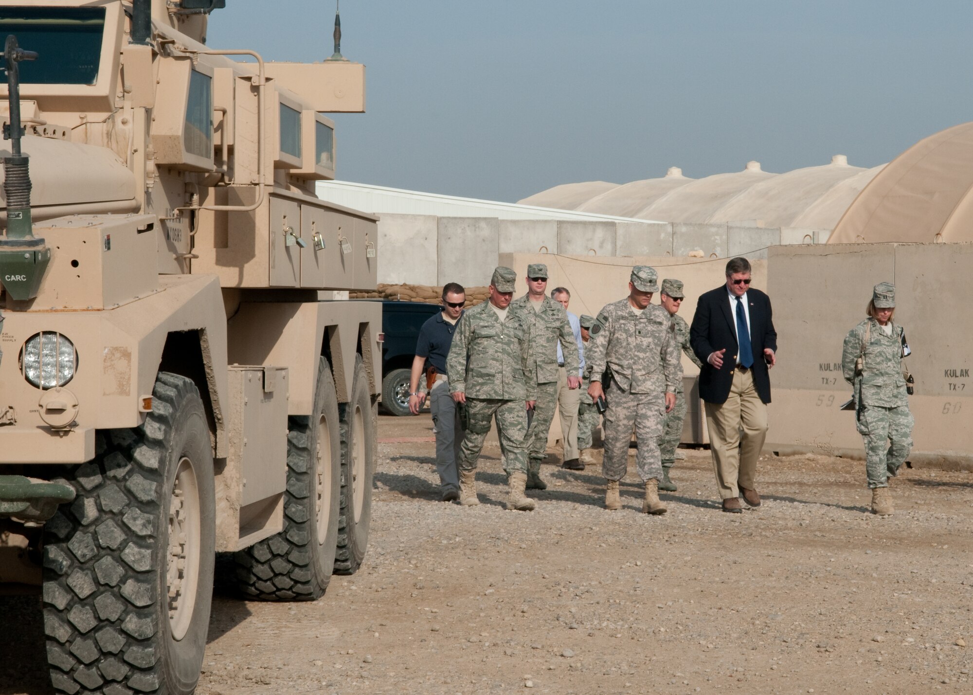 Lt. Col. Steven Ramsay, deployed from the 81st Training Group at Keesler, explains the mission of the Logistics Military Advisory Team to Secretary of the Air Force Michael Donley as they walk by a mine resistant ambush protected vehicle during Secretary Donley’s visit to Ali Base, Iraq.  Colonel Ramsay is LMAT’s senior adviser, and its joint expeditionary tasking Airmen are assigned to the Army’s 4th Brigade Combat Team, 1st Armored Division.  The LMAT mission is to advise, train and mentor Iraqi army location commands on long-term sustainment.  (U.S. Air Force photo by Senior Master Sgt. Elizabeth Gilbert)