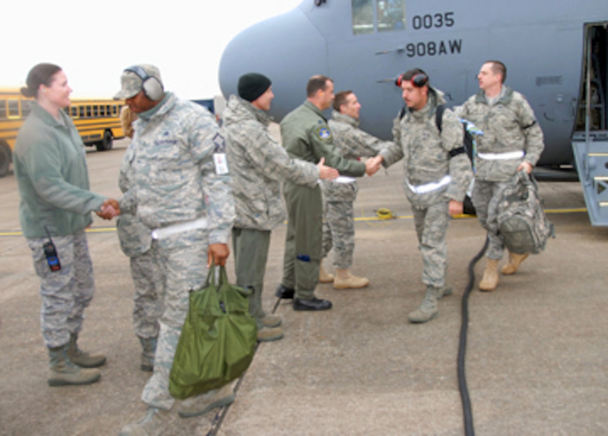 Members of the 908th Airlift Wing are greeted by, from left, Major Madalyn Marlatt, commander of the 908th Aircraft Maintenance Squadron; Lt. Colonel Scott Hayes, commander of the 357th Airlift Squaron; Lt. Colonel Craig Drescher, commander of the 908th Operations Support Flight; and Colonel Rob Shepherd, wing vice commander, as they disembark a C-130H aircraft after returning from the unit's Operational Readiness Inspection in Gulfport, Miss. After carefully observing the wing's ability to deploy, sustain operations and redeploy, the Air Mobility Command Inspector General's team declared the unit 'fit to fight.'