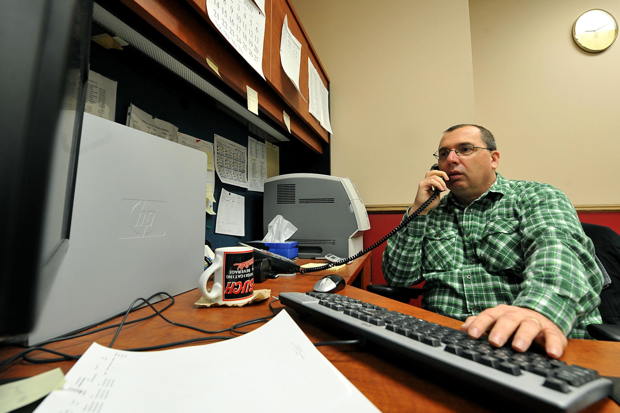 OFFUTT AIR FORCE BASE, Neb. -- Tom Kovy, logistics management specialist with the 55th Mission Support Group, assists a telephone customer at the passenger terminal here Feb. 11. Space-available flights for military members, family members and military retirees to places such as Peterson AFB, Colo., Scott AFB, Ill., and Andrews AFB, Md., are available from Offutt. 

U.S. Air Force photo by Charles Haymond