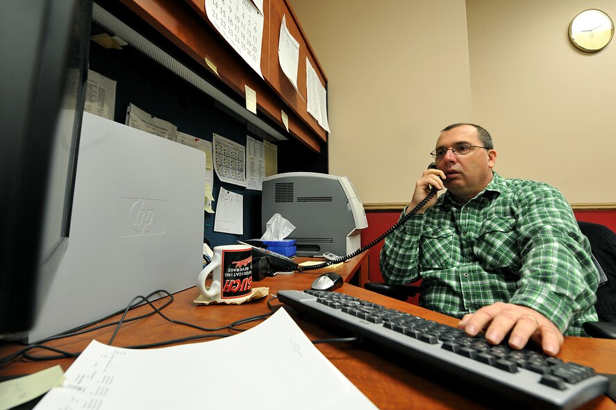 OFFUTT AIR FORCE BASE, Neb. -- Tom Kovy, logistics management specialist with the 55th Mission Support Group, assists a telephone customer at the passenger terminal here Feb. 11. Space-available flights for military members, family members and military retirees to places such as Peterson AFB, Colo., Scott AFB, Ill., and Andrews AFB, Md., are available from Offutt. 

U.S. Air Force photo by Charles Haymond
