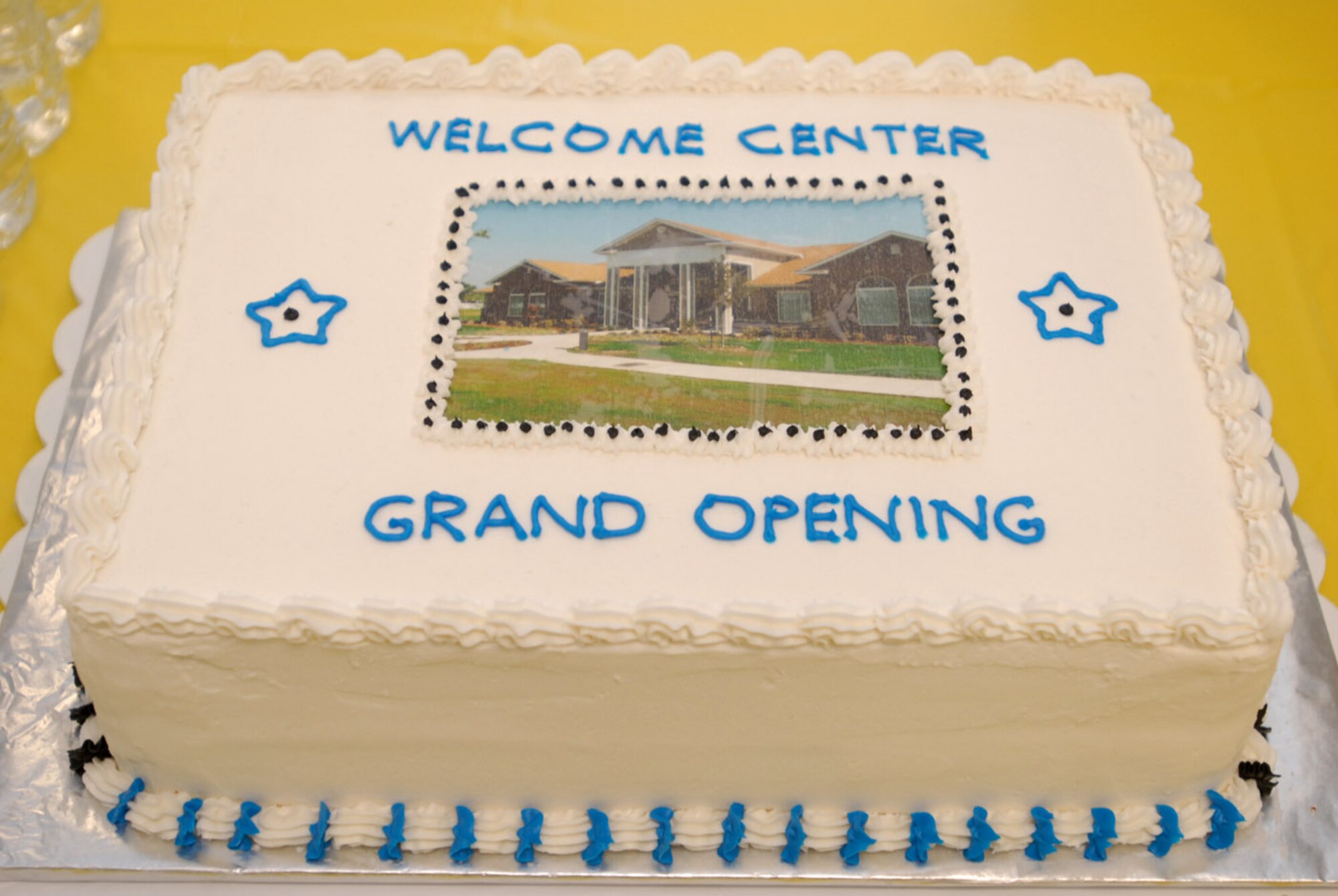 A photo of the community welcoming center for the Landing at Goodfellow adorn a cake at the ribbon cutting ceremony Feb. 10. The City of San Angelo donated more than 100 acres of land to house 133 single homes and duplexes for servicemembers and their families stationed at Goodfellow Air Force Base, Texas. (U.S. Air Force photo/ Senior Airman Tong Duong)