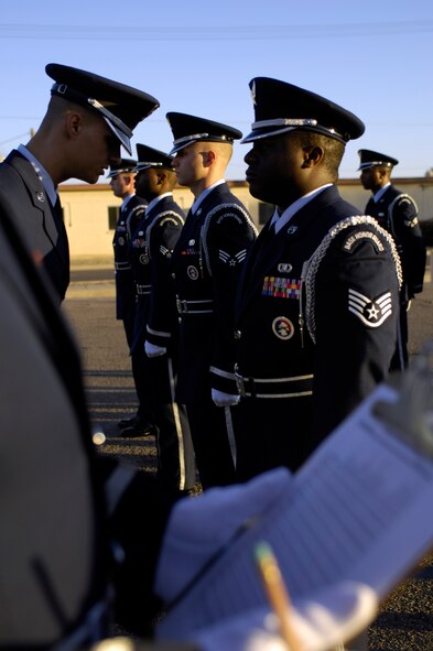 Airman 1st Class Michael Giles, Luke Honor Guard Flight Sergeant, inspects members of the Honor Guard during an open ranks inspection on the morning of Feb. 9, 2010 at Luke Air Force Base, Ariz. Wearing a ceremonial uniform, the Honor Guard members are held to a strict standard on dress and appearance. (U.S. Air Force Photo by SSgt Jason Colbert)