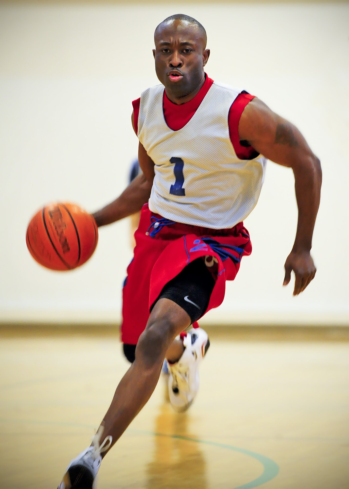 Tech. Sgt. Patrick Obermuller, 92nd Medical Operations Squadron, dribbles down the basketball court during the intramural basketball game at the base Fitness Center here Feb. 3. (U.S. Air Force photo/Senior Airman Joshua Chapman)