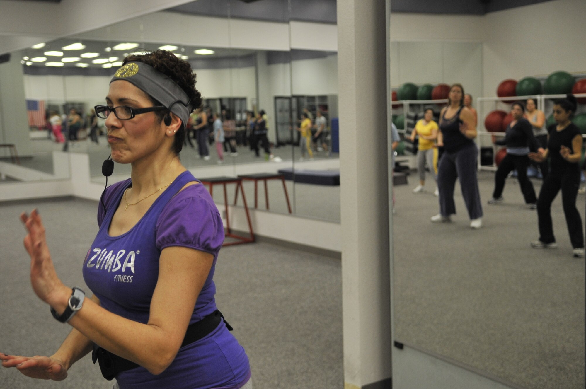 Edna Martinez leads a Zumba class at the base gym on Monday. Zumba is a Latin based exercise program that has gained popularity in the last few years. Classes are held each Monday at 5 p.m.  (U.S. Air Force photo/Staff Sgt. Chad Watkins)