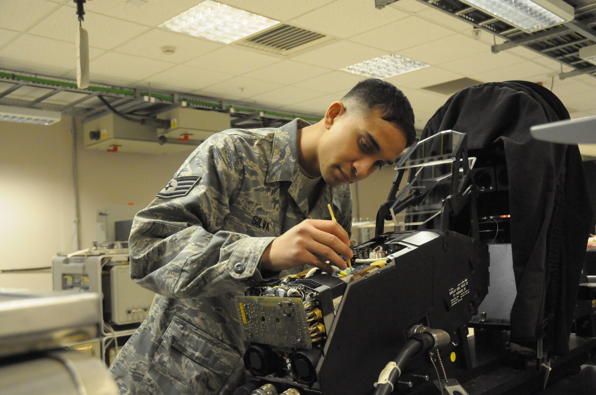 Staff Sgt. David Silva, 48th Component Maintenance Squadron Avionics Intermediate Section team leader, works on an F-15C heads up display unit at RAF Lakenheath, England, Feb. 10. He was nominated for the Liberty Spotlight by his chain of command because he epitomizes the Air Force core value of "Service Before Self."  (U.S. Air Force photo by Staff Sgt. Connor Estes)

