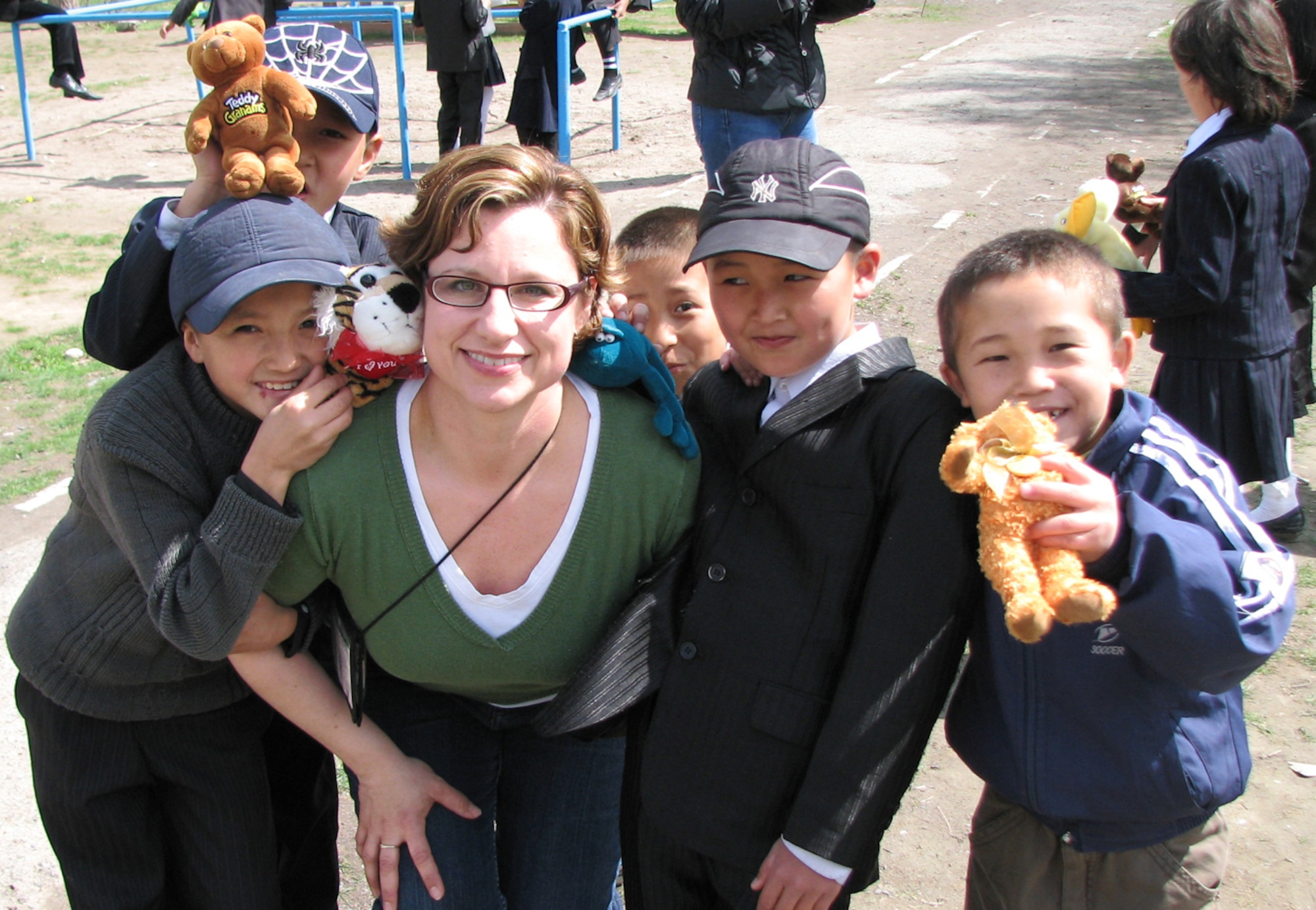 Master Sgt. Hayden Pickett, 100th Communications Squadron first sergeant, and civil engineer first sergeant during her deployment to Manas, Kyrgyzstan, from March to July 2009, along with many others, volunteered in the Kyrgyzstan community to help schools, orphanages and people with special needs to show the Kyrgyztan Republic community the giving spirit of Americans. (Courtesy photo)